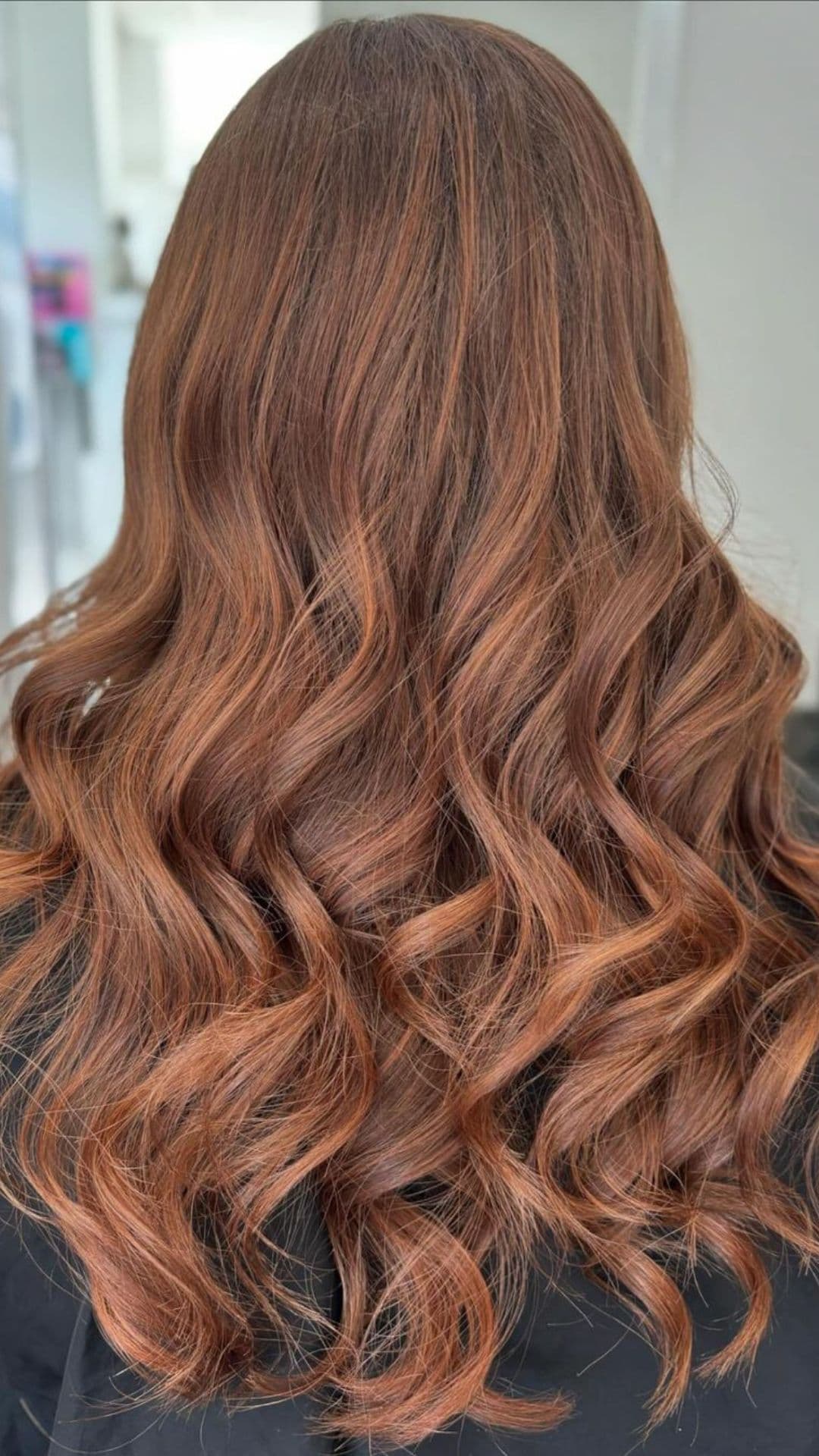 A woman modelling a light brown hair with a subtle balayage.